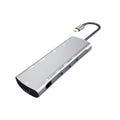 Grey aluminium alloy USB-C docking station with HDMI, VGA, and USB 3.0 ports and integrated 140mm cable
