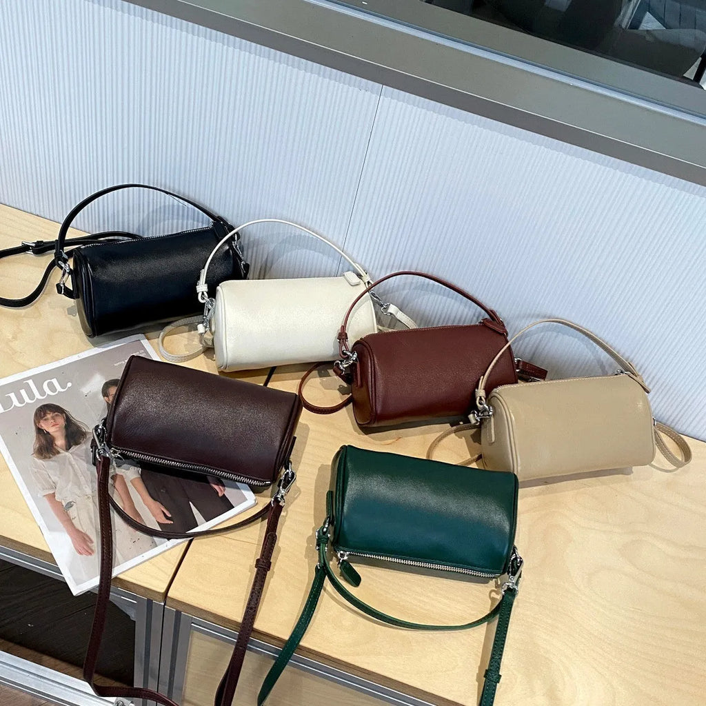 Genuine leather cylindrical crossbody phone bag in multiple colours with an adjustable strap.