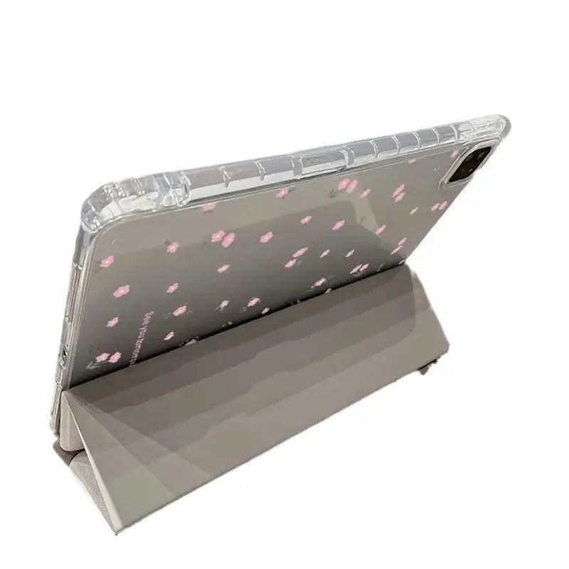 Transparent floral tri-fold hard case for iPad showing magnetic closure and stylus loop.