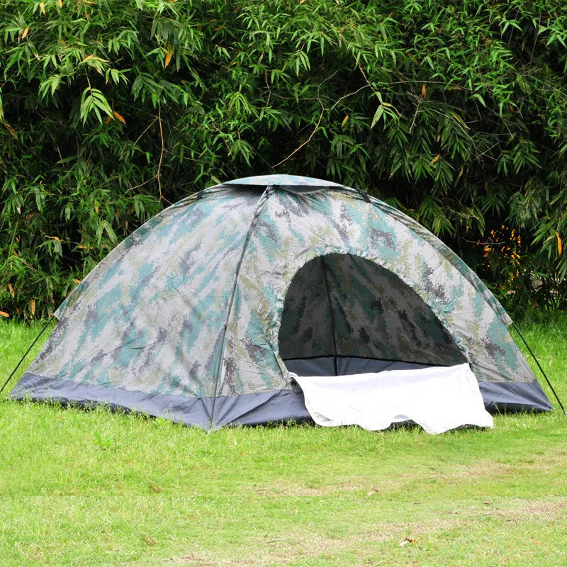 Green camouflage camping tent with triangular skylight, breathable mesh panels, and steel ground nails set up outdoors