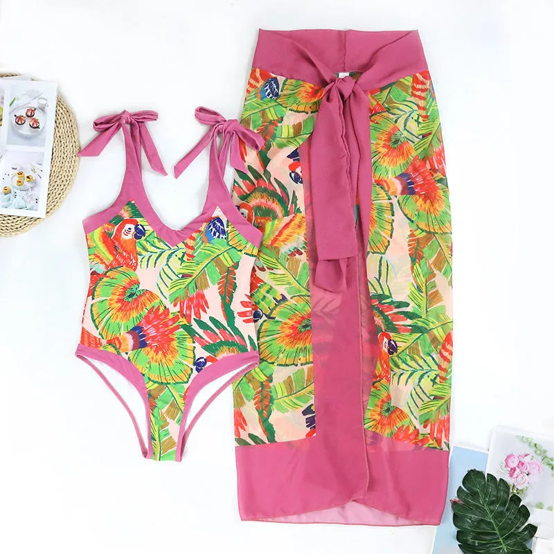 Retro pink floral print one-piece swimsuit for women with V-neck, tummy control and attached skirt