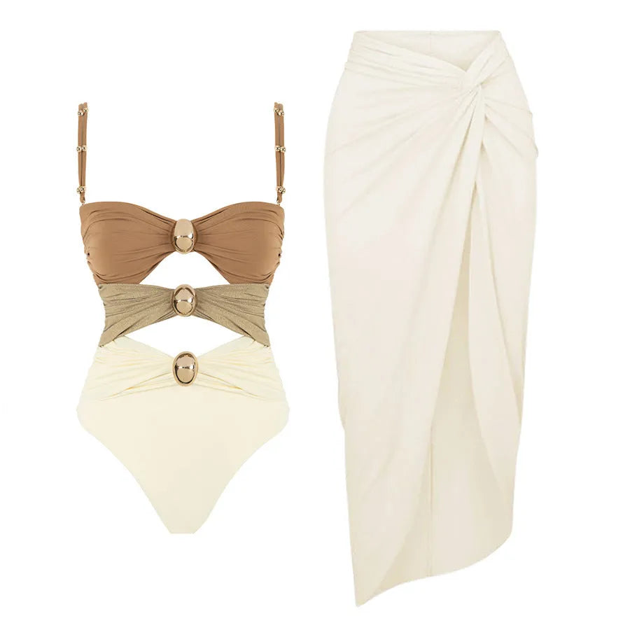 Women's solid colour one-piece swimsuit with matching skirt and gold button detailing