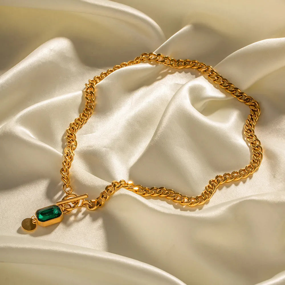 Gold electroplated titanium steel necklace with French retro geometric pendant and emerald zircon details