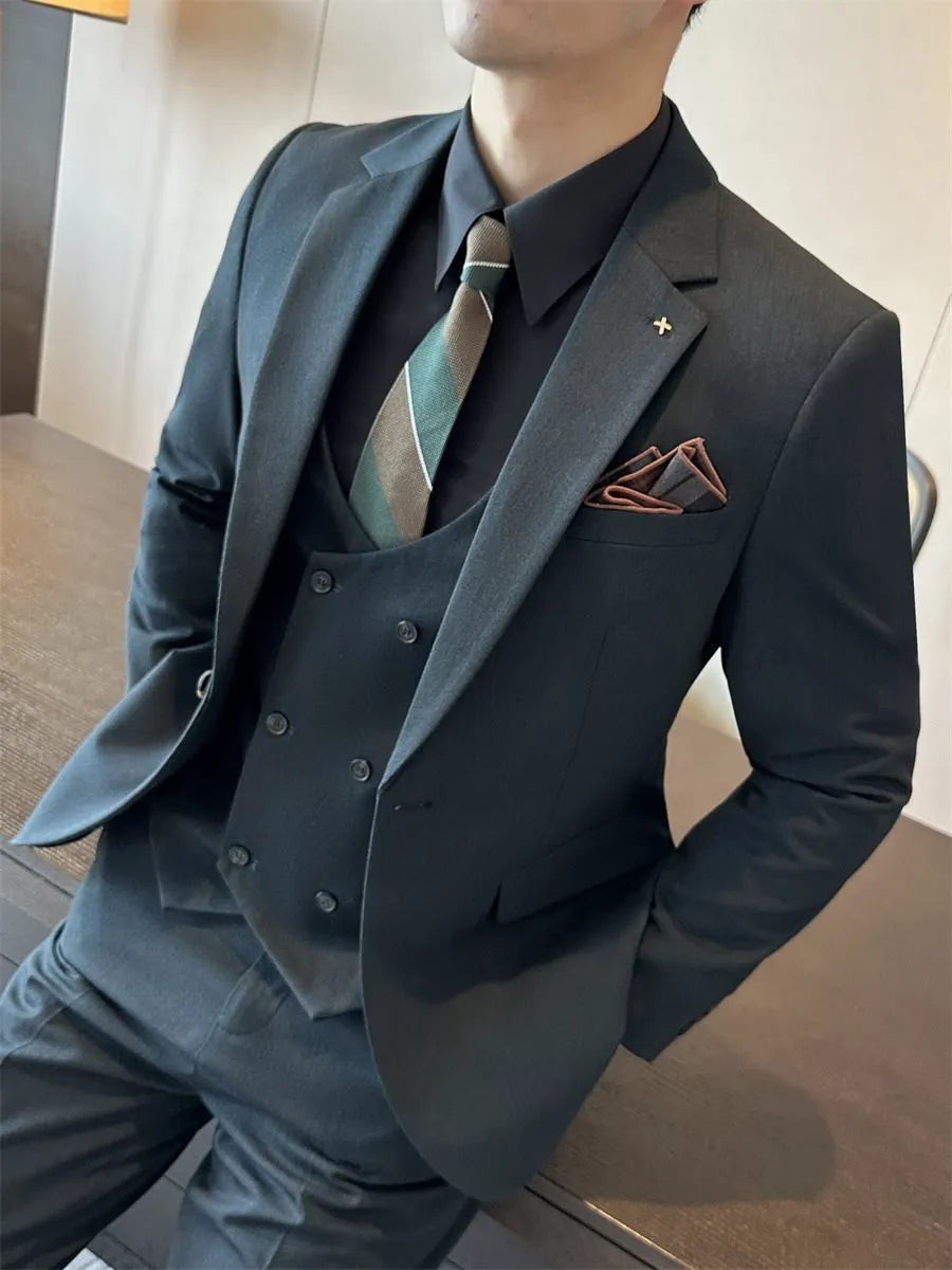 Men's slim fit formal suit jacket in dark green, shown on a model, featuring a notched lapel and button front.