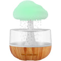 White USB micro humidifier and aromatherapy diffuser with colourful night light on.