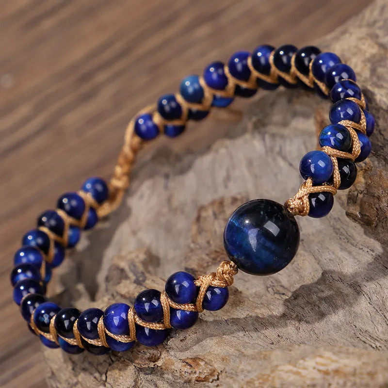 Handmade woven geometric bracelet with blue Tigereye beads and an adjustable pull fastening.