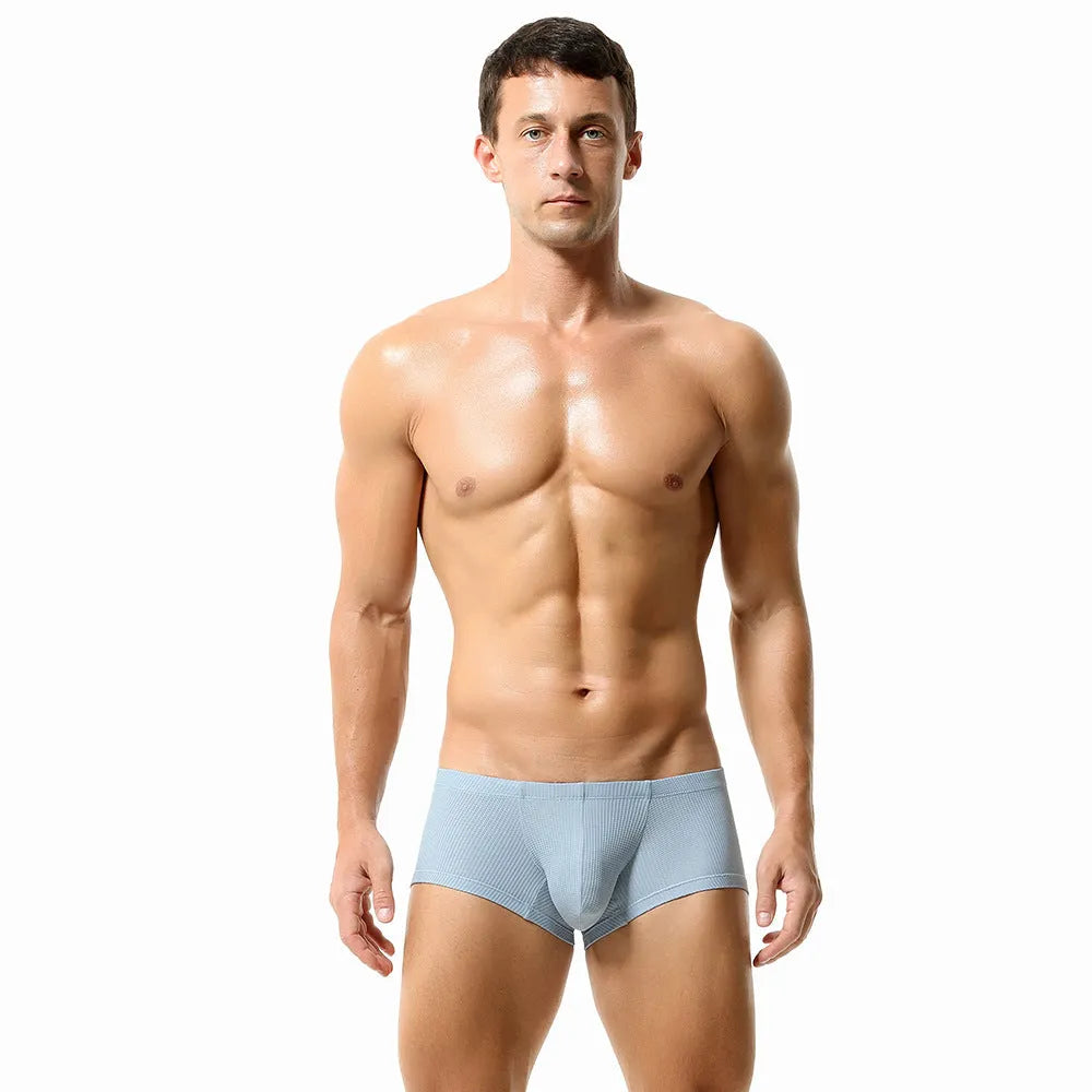 Men's solid colour nylon mid-low waist boxer shorts in orange, cloud blue, green, light blue, and milky white