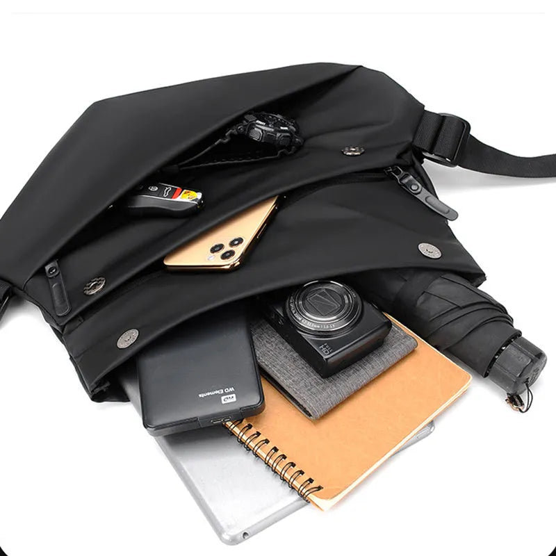 Grey horizontal square PU leather crossbody bag for men with a single shoulder strap.