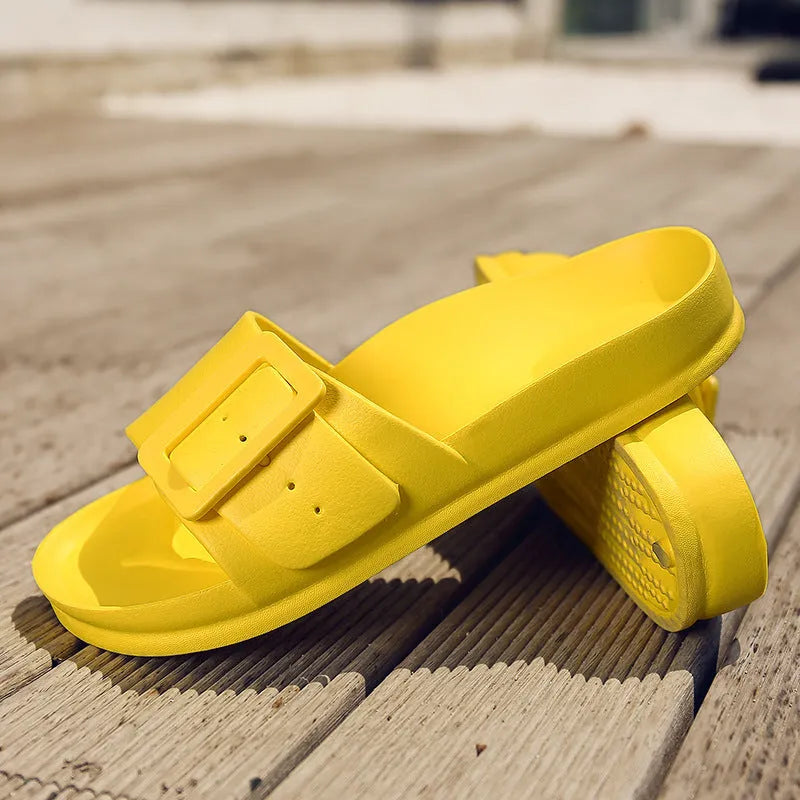 Women's grey blue EVA slippers with an adjustable silver buckle on the strap.