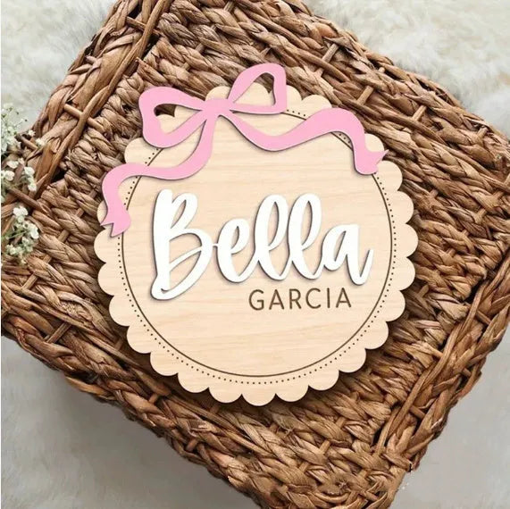 Custom wooden square ornament with a personalised baby name for nursery decoration.