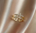 Adjustable copper women's ring featuring a double cross design inlaid with zircon gemstones in a sterling silver setting.