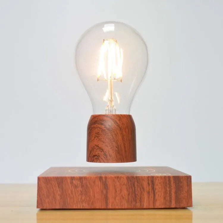 Magnetic levitation floating bulb lamp with ABS glass construction on imitation wood base