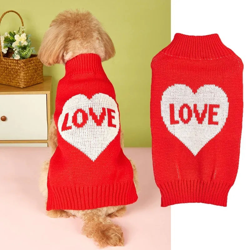 Dog wearing red love heart and pink bow decorated acrylic sweater