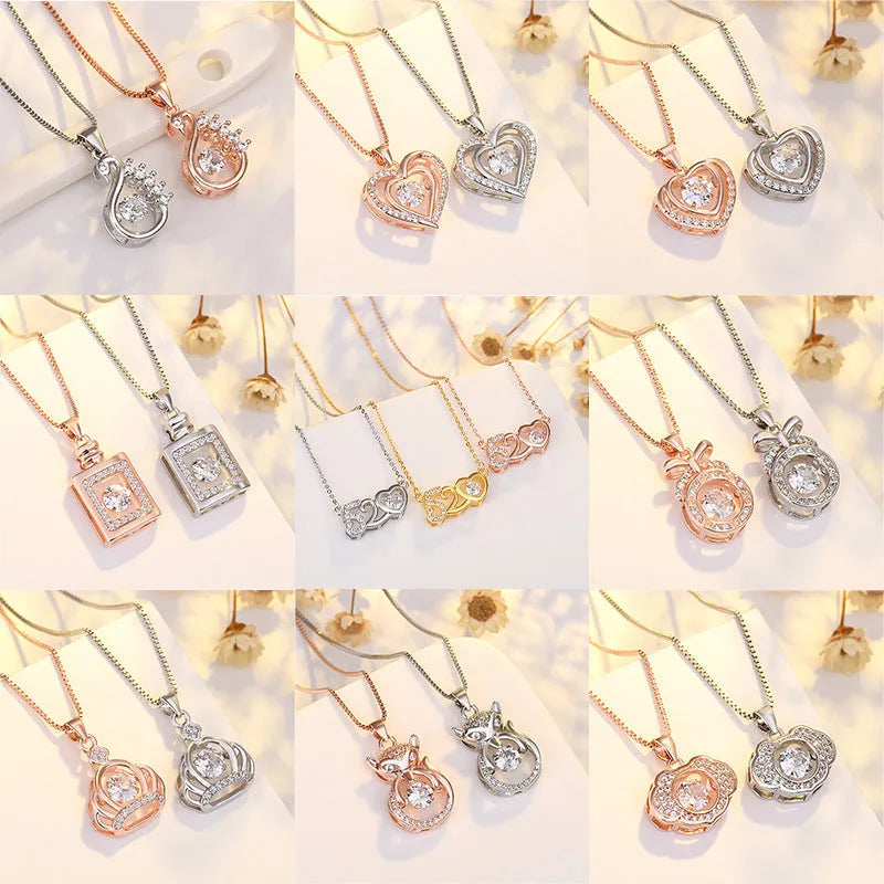 Silver tone heart pendant necklace with crown and bow charm on a model.
