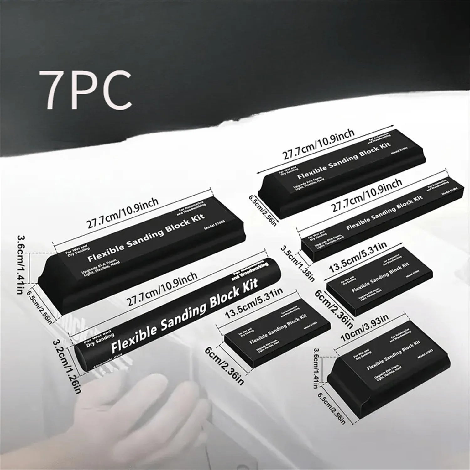 Set of seven black frosted metal alignment blocks for workshop use.