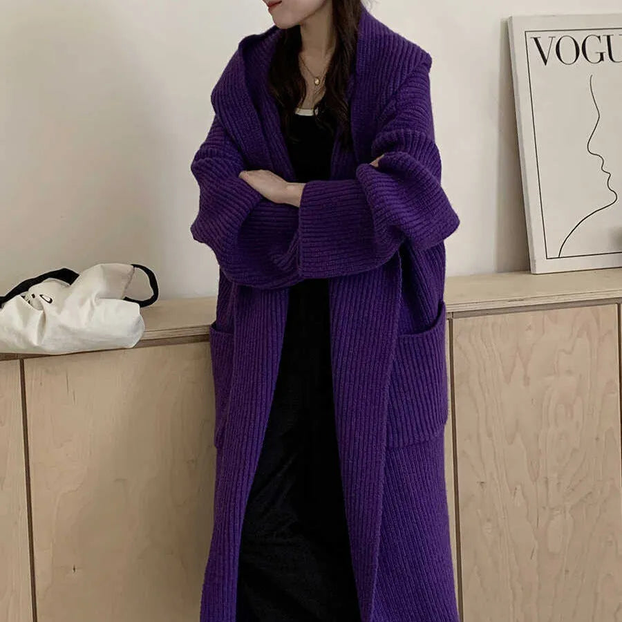 Women's loose hooded cardigan coat in acrylic fabric with raglan sleeves showing front opening