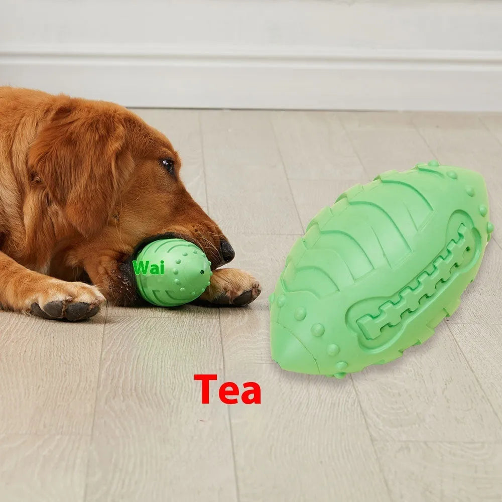 Light green bite-resistant rubber rugby ball dog toy with vocal feature for teeth cleaning and training.