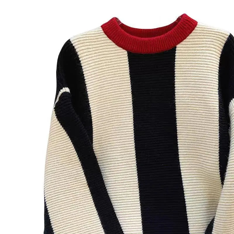Women's striped cashmere knit pullover sweater with contrast colour and round neck.