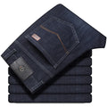 Women's black stretch jeans with straight-leg business casual styling and mid-waist zip placket