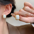 Geometric circular Korean style earrings with hand-woven mixed material construction in X0439 colour