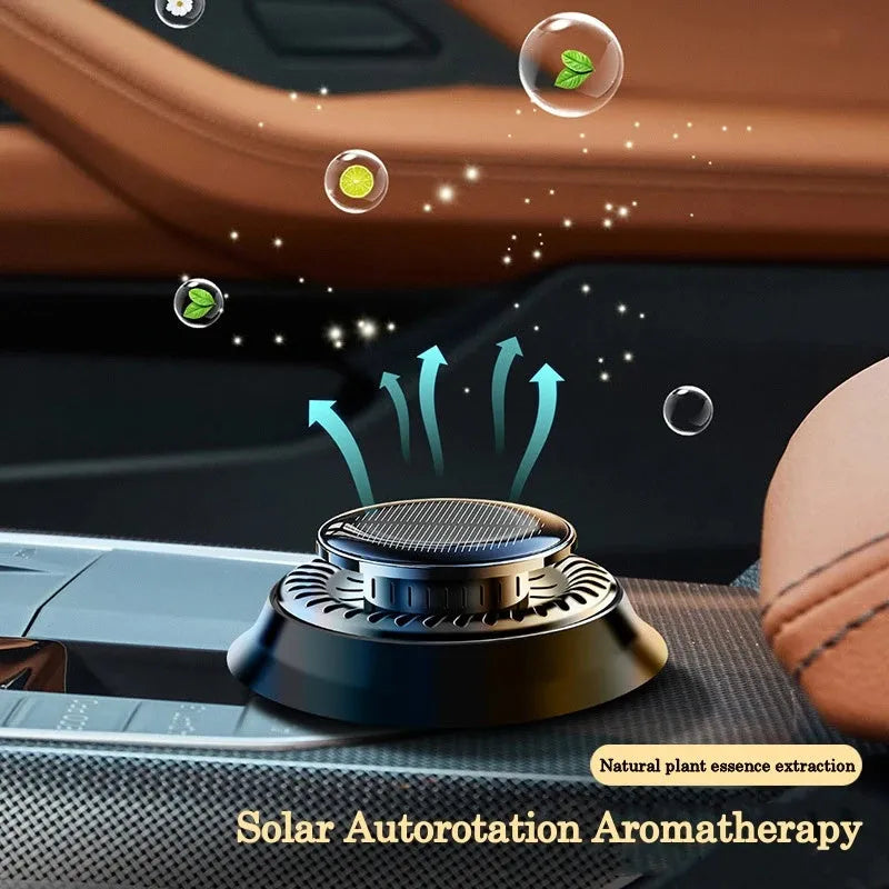 Solar powered double ring rotating car air freshener in Black Ocean colour placed on car dashboard