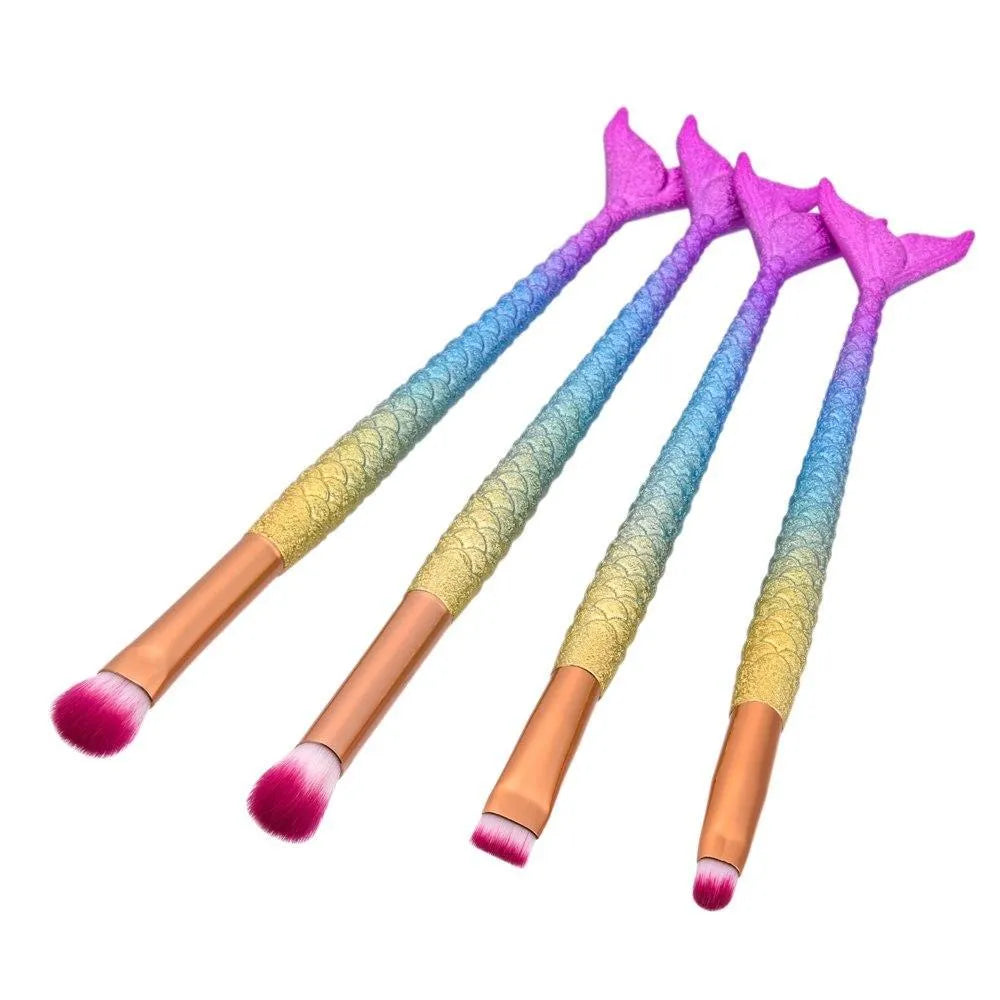 10 mermaid makeup brushes with multicolour nylon bristles and plastic handles laid flat