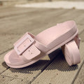 Women's grey blue buckle slipper made of soft EVA material on a plain background