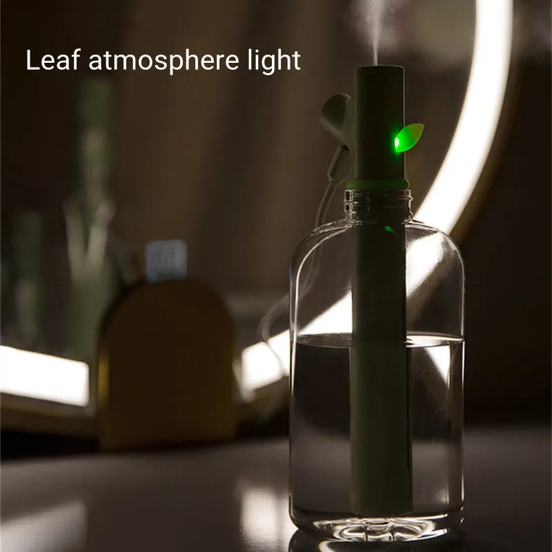 Mini portable USB air humidifier with branch nozzle, transparent plastic, 197mm tall, producing cool mist
