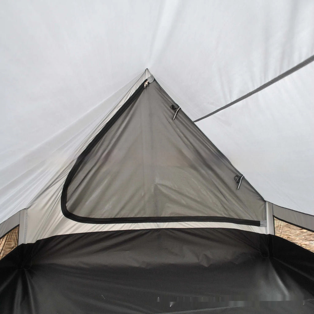 Brown A-frame hiking tent supported by hiking poles showing spacious interior for 2-3 campers