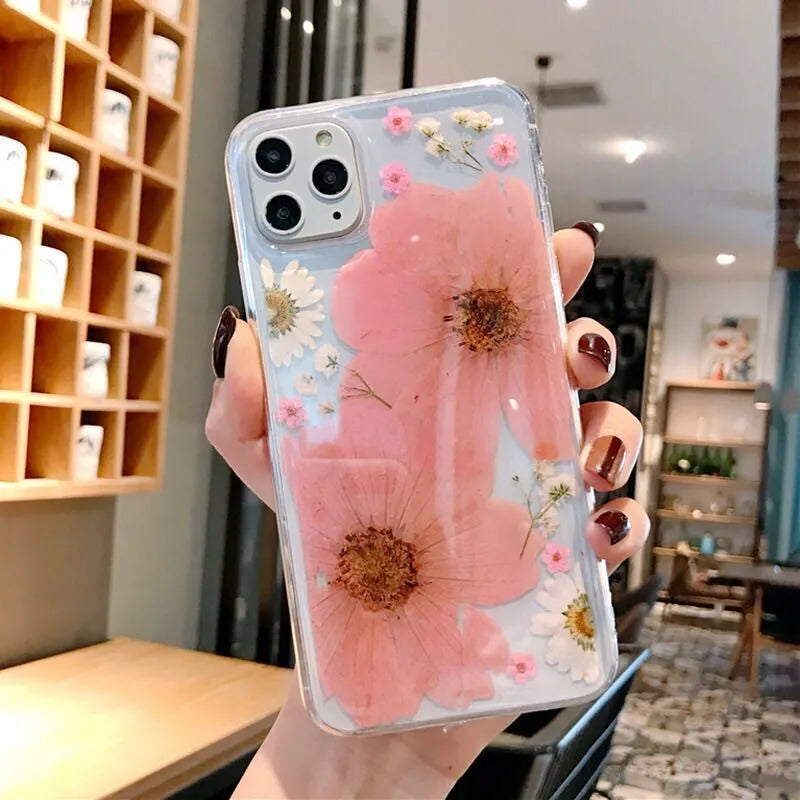 Floral patterned TPU phone case for iPhone in pink and yellow flower designs.