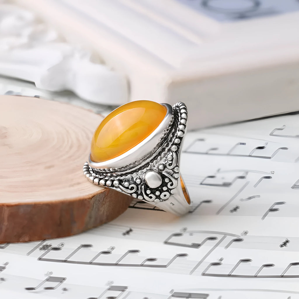 Geometric alloy ring with fluorescent beeswax plating in antique silver amber finish