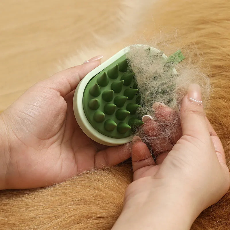 Soft silicone handheld pet hair remover and massage brush in dark blue on a white background.