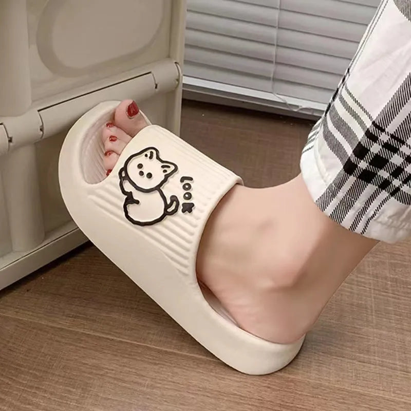 Women's green EVA flip-flop slippers with cute cat design and thick platform sole.