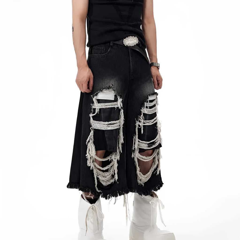 Black cropped wide-leg women's jeans with ripped patch detail on the knee.
