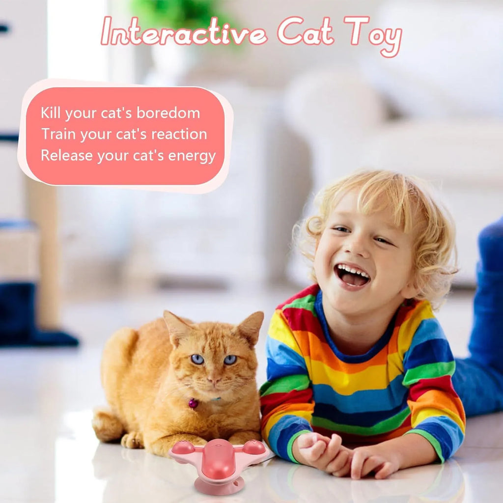 Blue interactive pet puzzle feeder toy with bell, catnip and snack cabin on a floor.