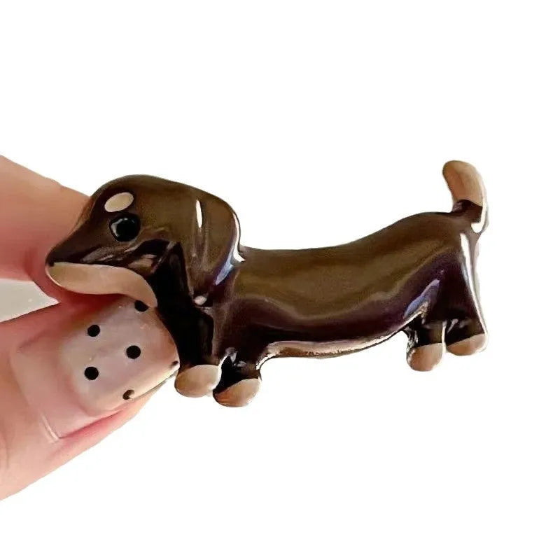 Cute dachshund dog barrettes with electroplated finish on light background