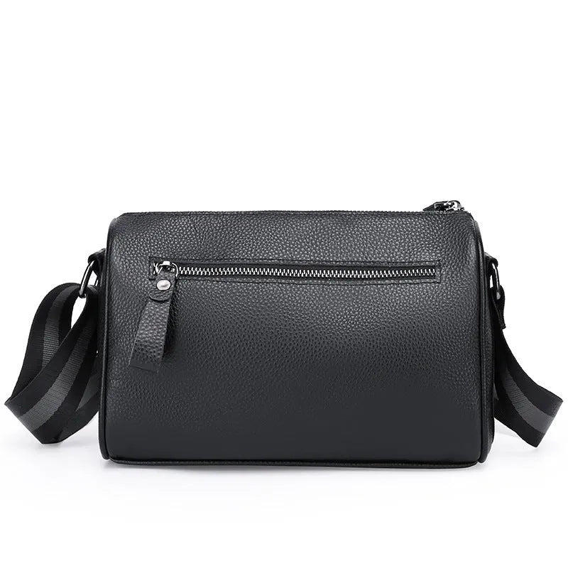 Black genuine leather crossbody bag showing front view with single shoulder strap