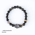 Handmade unisex lying rabbit Jin Yaoshi obsidian bracelet with gray agate and brass beads on neutral background