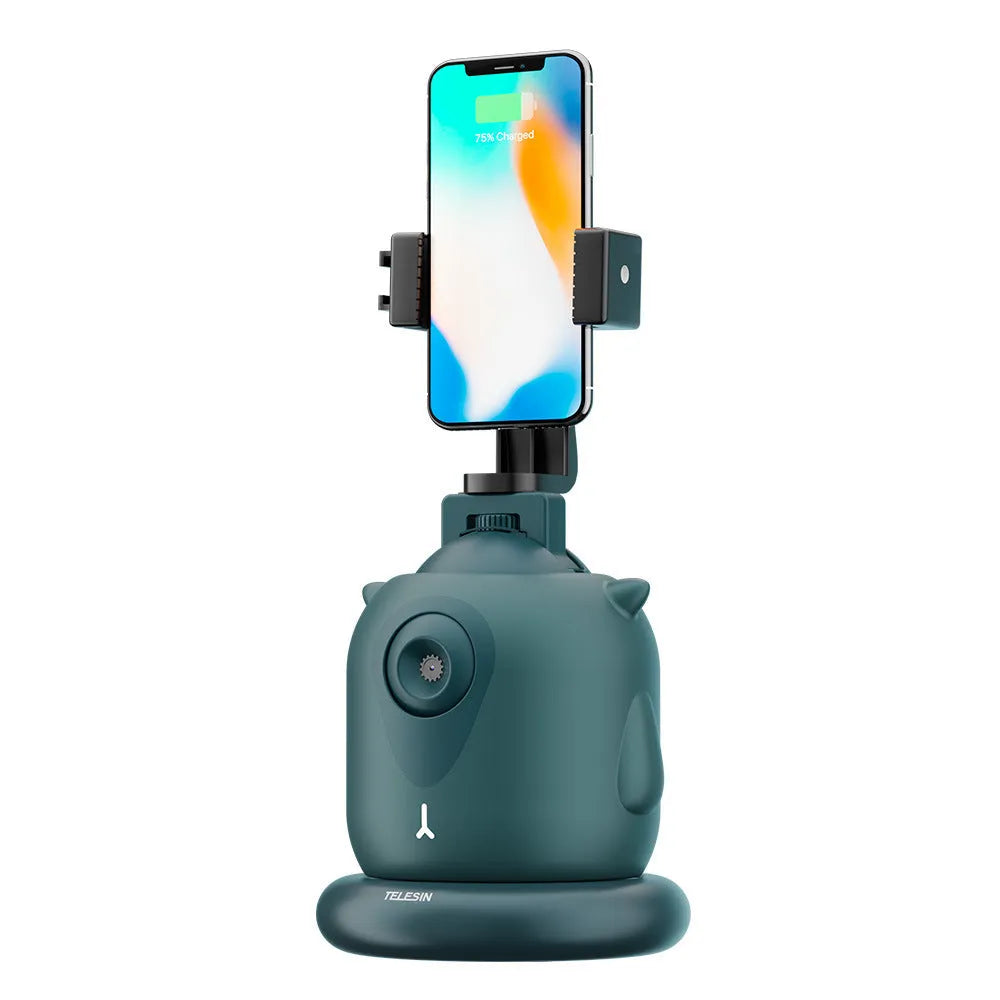 Dark green intelligent follow-up gimbal with 360-degree rotation on a desktop