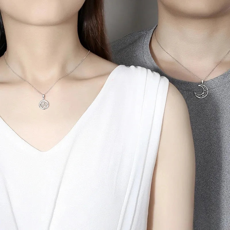 Copper sun and moon tooth couple necklace with electroplated finish on cross chain.