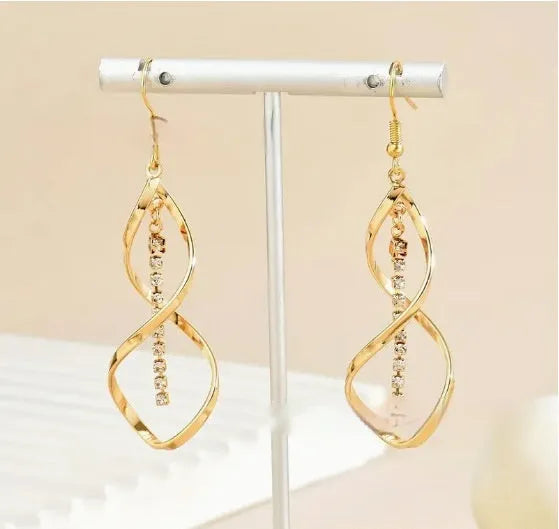 Gold electroplated alloy earrings with spiral geometric ellipse design for women