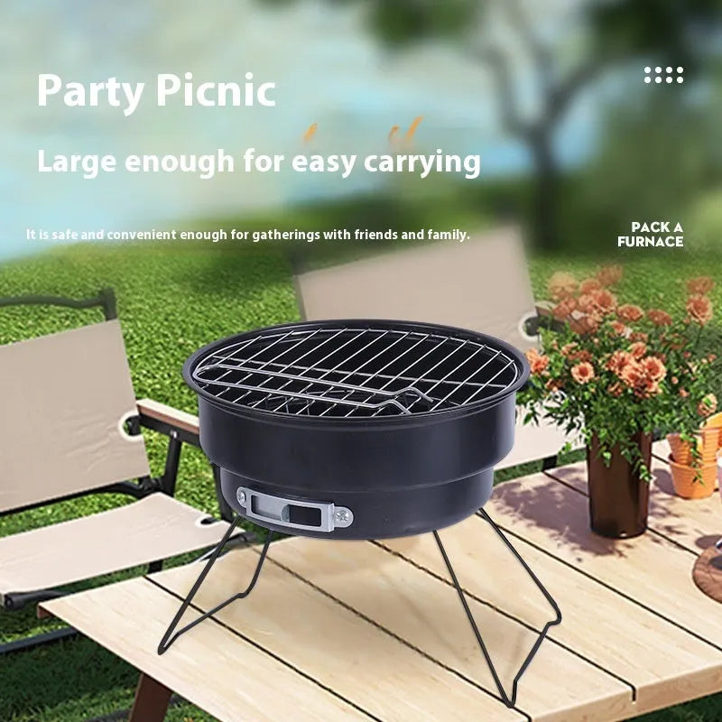 Small portable folding round ice stove barbecue grill set with mesh, legs, and clip on a grey background.