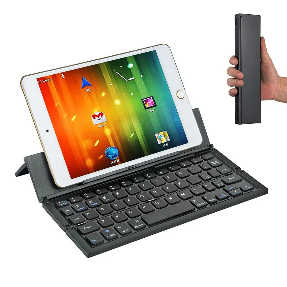 Mini folding ultra-thin wireless Bluetooth keyboard in black, open and ready for typing with a tablet