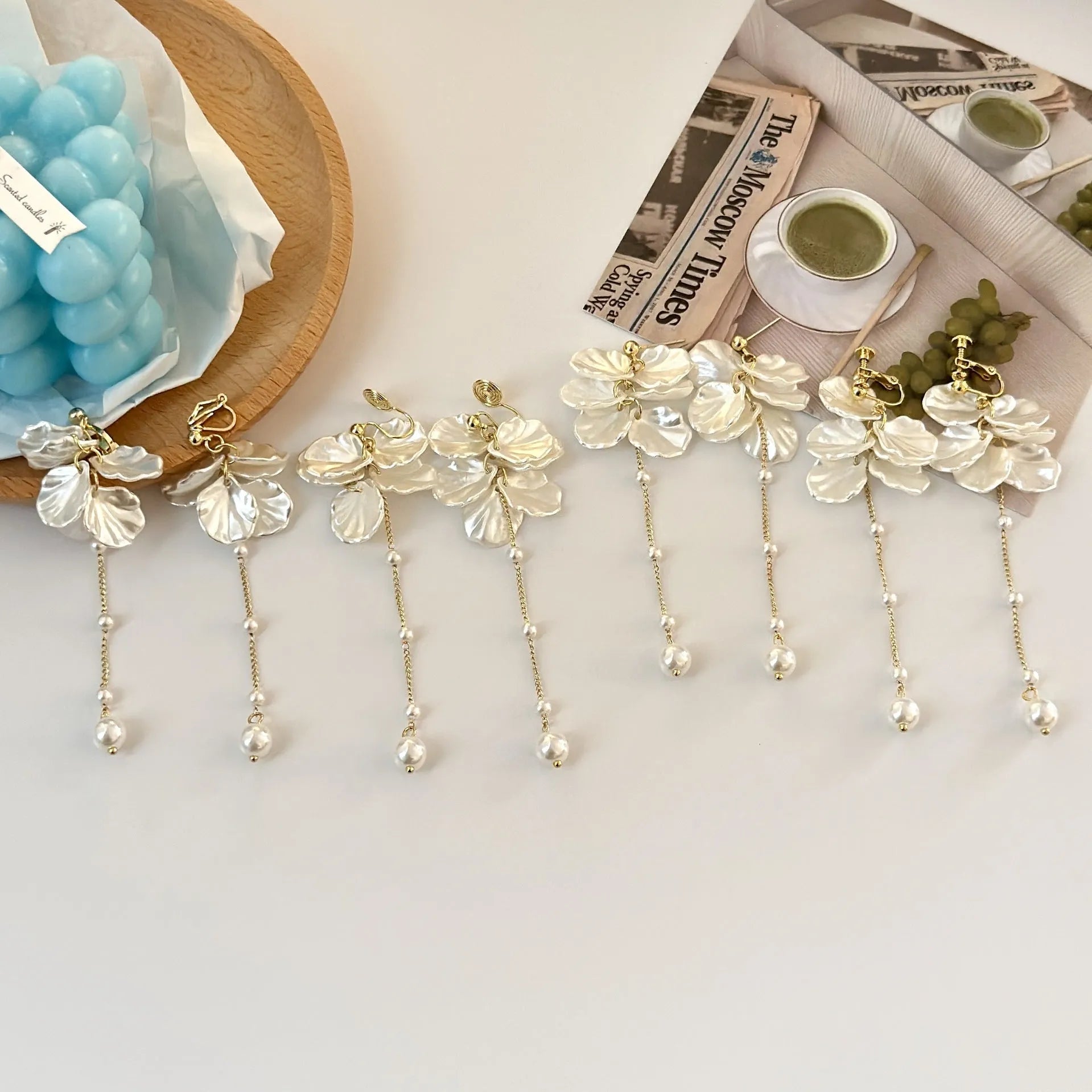 Women's acrylic shell pearl tassel earrings showing 8.8cm length and four ear clip options