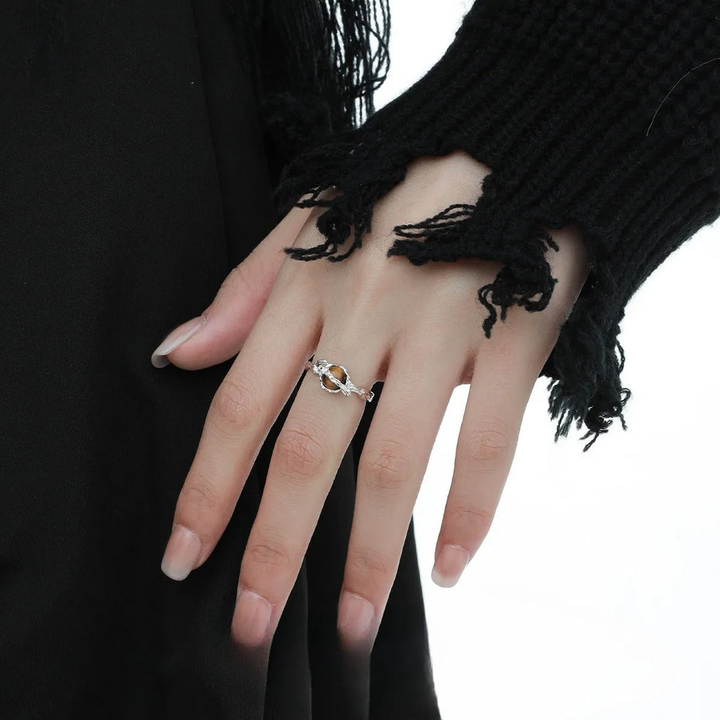 Women's Saturn design open ring with adjustable silver band and tigereye stone detail