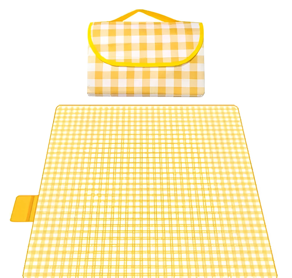 Thickened outdoor picnic mat in green grid non-woven fabric, folded on grass