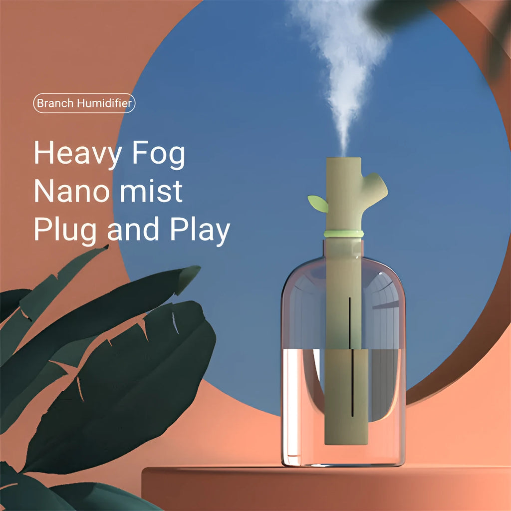 Mini portable USB air humidifier with branch nozzle, transparent plastic, 197mm tall, producing cool mist