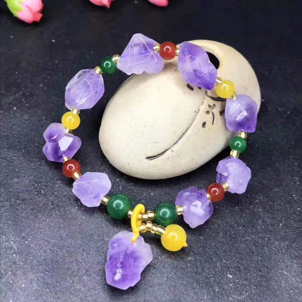Natural shaped purple amethyst gemstone bracelet with a carved Fu character charm.