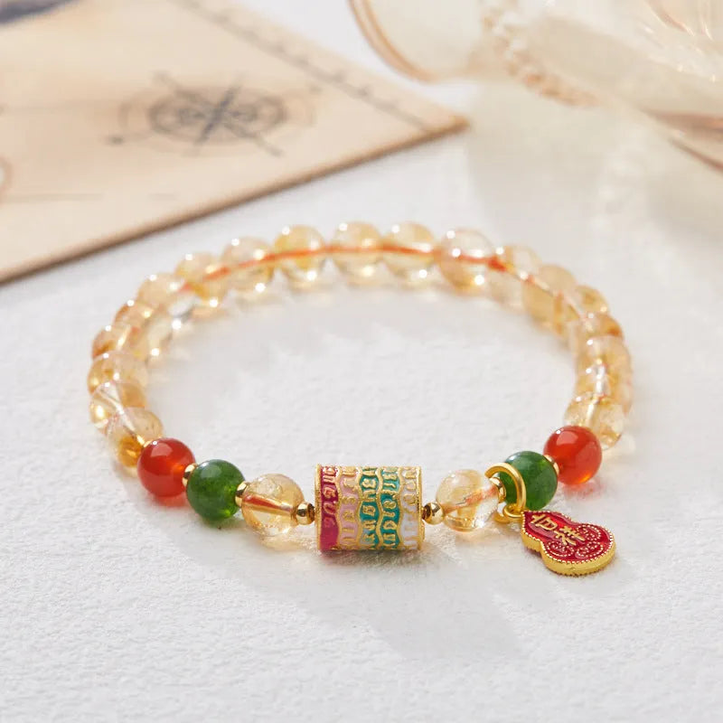 Citrine five sutra hand-woven crystal bracelet with geometric design on neutral background
