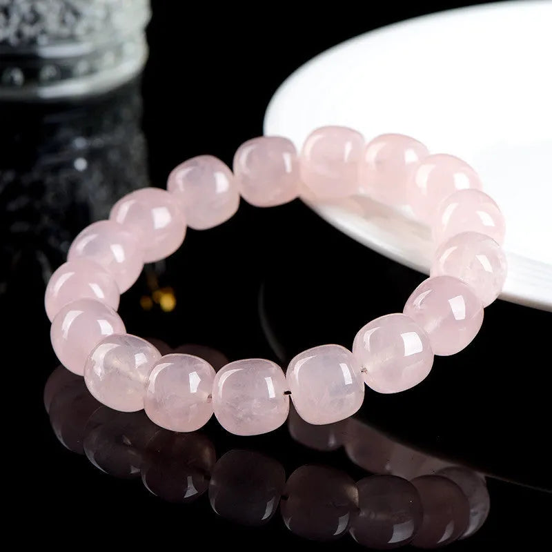 Pink crystal barrel bead bracelet with geometric design and 11-12mm beads